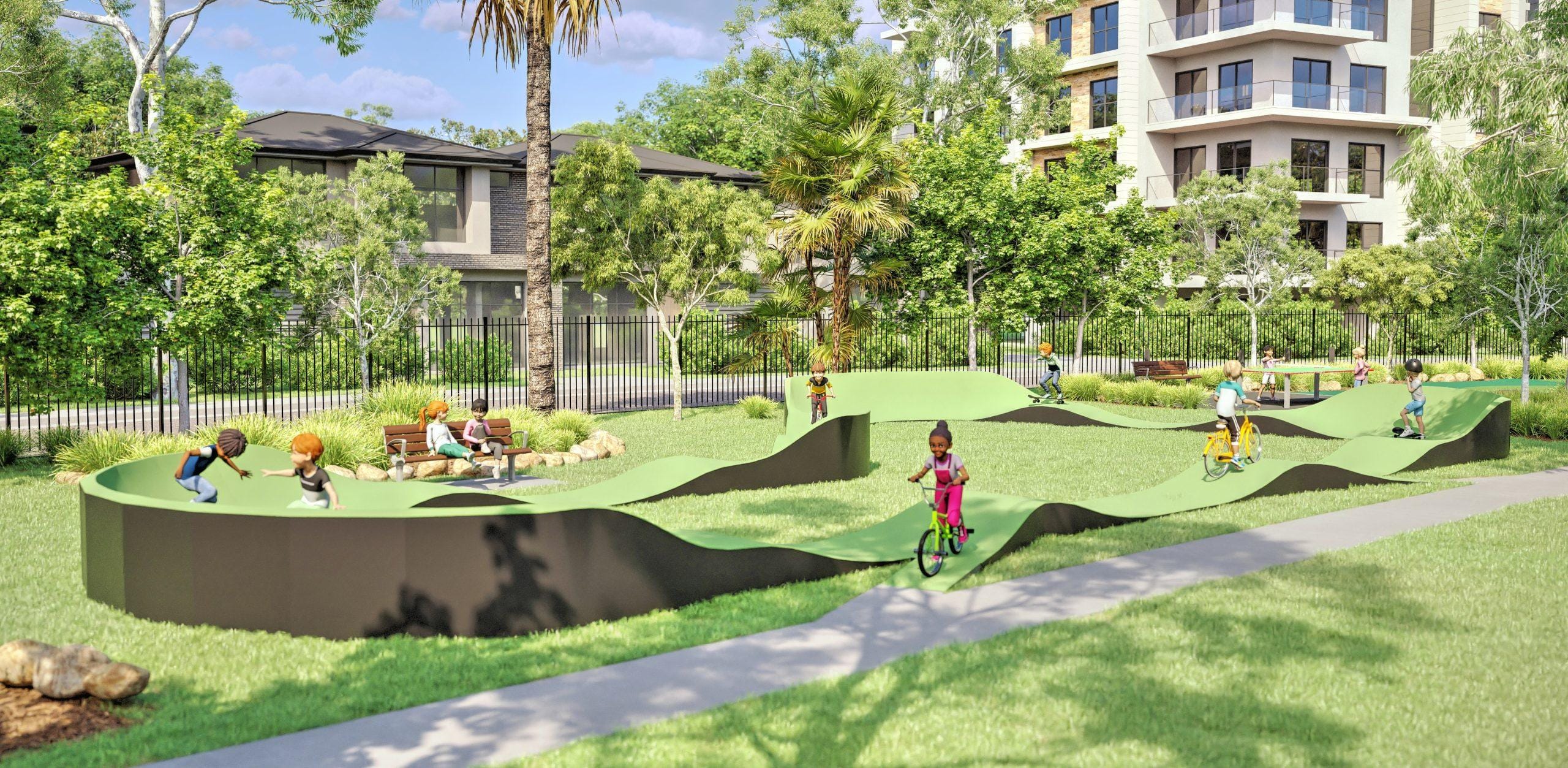 A TUSCO modular pump track render set in a landscaped park